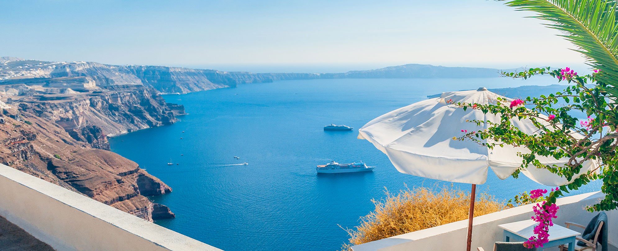 Panoramic view of the ocean and mountains in Santorini Island, Greece.